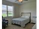 Cozy bedroom with comfortable bed, window, and dresser, creating a relaxing retreat at 3371 Yellowtop Loop, Clermont, FL 34714