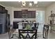 Bright dining area adjacent to the kitchen, featuring stylish decor and stainless steel appliances at 3371 Yellowtop Loop, Clermont, FL 34714