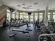 Well-equipped gym with treadmills, weights, and fitness machines for a complete workout experience at 3371 Yellowtop Loop, Clermont, FL 34714