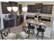 Well-appointed kitchen with stainless steel appliances, ample counter space, and stylish lighting at 3371 Yellowtop Loop, Clermont, FL 34714