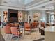 Bright living area features comfortable seating, a fireplace, and modern decor for relaxing and entertaining guests at 3371 Yellowtop Loop, Clermont, FL 34714