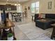 Spacious living room with dining area and comfortable furniture, blending style and functionality at 3371 Yellowtop Loop, Clermont, FL 34714
