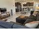 Open-concept design seamlessly integrates the living room, dining area, and kitchen for modern living at 3371 Yellowtop Loop, Clermont, FL 34714