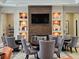 Club lounge with comfortable seating around small tables at 3371 Yellowtop Loop, Clermont, FL 34714