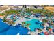 Aerial view of the community pool area with ample seating and lush landscaping at 3715 Lana Ave, Davenport, FL 33897