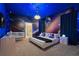 A themed bedroom features unique space-themed wall art, a comfortable bed, and modern furnishings at 3715 Lana Ave, Davenport, FL 33897