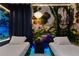 View of a themed bedroom with Avatar-themed wallpaper, two twin beds, and unique modern lighting at 3715 Lana Ave, Davenport, FL 33897