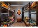 Themed bedroom boasts four bunk beds and Star Wars decor and bedding at 3715 Lana Ave, Davenport, FL 33897