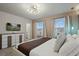 Modern bedroom with neutral tones, plenty of natural light, and stylish furniture at 3715 Lana Ave, Davenport, FL 33897