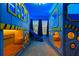 Minion themed bedroom featuring custom bunk beds, blue walls, and a slide, creating a fun space at 3715 Lana Ave, Davenport, FL 33897