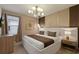 Luxurious bedroom features a king-sized bed, designer lighting, and elegant decor at 3715 Lana Ave, Davenport, FL 33897
