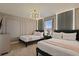 Stylish bedroom featuring two twin beds, modern lighting, and elegant decor at 3715 Lana Ave, Davenport, FL 33897