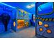 A themed bedroom features unique decor and a custom-built bunk bed with a slide for creative play at 3715 Lana Ave, Davenport, FL 33897