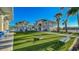 Well-manicured community amenity area with artificial turf, benches, and recreational activities at 3715 Lana Ave, Davenport, FL 33897