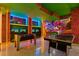 Mario themed game room featuring foosball, ping pong, computer games, and bright lighting at 3715 Lana Ave, Davenport, FL 33897