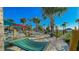 Relaxing hammock area with multiple hammocks, set in a sandy landscape and lush palm trees at 3715 Lana Ave, Davenport, FL 33897