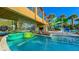 Beautiful lazy river with lush landscaping, a waterfall bridge, and colorful inner tubes for a relaxing ride at 3715 Lana Ave, Davenport, FL 33897
