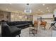 Spacious living room is adjacent to dining and kitchen areas and offers comfortable seating and stylish decor at 3715 Lana Ave, Davenport, FL 33897