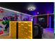 Awesome media room featuring a bar, movie screen, and Marvel superhero themed decor at 3715 Lana Ave, Davenport, FL 33897