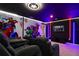 Comfortable theater seating in this media room with awesome Marvel superhero themed decor at 3715 Lana Ave, Davenport, FL 33897