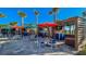 Inviting outdoor bar area with multiple seating areas, televisions, and a vibrant social atmosphere at 3715 Lana Ave, Davenport, FL 33897