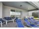 Covered patio with comfortable seating and chaise lounges at 3715 Lana Ave, Davenport, FL 33897