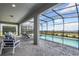 Covered pool area with patio furniture and a scenic view at 3715 Lana Ave, Davenport, FL 33897