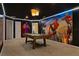 Recreation room with Marvel superhero murals, neon lighting, and a pool table at 3715 Lana Ave, Davenport, FL 33897