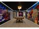Recreation room with a pool table, Marvel themed murals, and modern lighting at 3715 Lana Ave, Davenport, FL 33897
