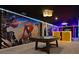 Recreation room with pool table, custom wet bar, and Marvel superhero themed decor at 3715 Lana Ave, Davenport, FL 33897