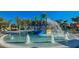 Fun splash pad with colorful play structures, water fountains, and lounge chairs for relaxation at 3715 Lana Ave, Davenport, FL 33897