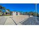 Sandy volleyball court next to a community building and volleyball net at 3715 Lana Ave, Davenport, FL 33897