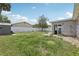 Large backyard featuring a storage shed and a white privacy fence at 3816 Tram Ct, Orlando, FL 32810