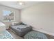 Cozy bedroom featuring a daybed, wood-look tile flooring, ceiling fan, and a window with blinds at 3816 Tram Ct, Orlando, FL 32810