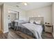 Bright bedroom featuring a queen bed, a crib, a ceiling fan, and a sliding door closet at 3816 Tram Ct, Orlando, FL 32810
