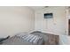 Small bedroom featuring a daybed, wood-look tile flooring, closet with folding doors, and a tv at 3816 Tram Ct, Orlando, FL 32810