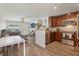 Bright and open kitchen featuring warm wood cabinets and a breakfast bar with bar stools at 3816 Tram Ct, Orlando, FL 32810