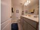 Bright bathroom features a double vanity with modern faucets and stylish gray cabinetry at 391 Cape Honeysuckle Pl, Sanford, FL 32771