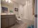 Bright bathroom with a shower-tub combo, and a vanity featuring modern fixtures at 391 Cape Honeysuckle Pl, Sanford, FL 32771