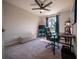 Bedroom with a ceiling fan, window with blue curtains, and a comfortable workspace at 391 Cape Honeysuckle Pl, Sanford, FL 32771