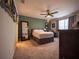 Tranquil bedroom with neutral tones, large window, and comfortable furnishings at 391 Cape Honeysuckle Pl, Sanford, FL 32771