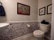 Charming half bathroom with decorative wallpaper and modern fixtures at 391 Cape Honeysuckle Pl, Sanford, FL 32771