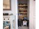 Pantry with wooden shelves with ample storage space for kitchen supplies and organized goods at 391 Cape Honeysuckle Pl, Sanford, FL 32771