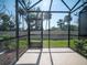 Screened-in patio providing an outdoor living space with views of the backyard and surrounding trees at 391 Cape Honeysuckle Pl, Sanford, FL 32771