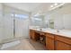 Bright bathroom featuring a large walk-in shower and double vanity with ample counter space at 4080 Oaktree Dr, Davenport, FL 33837