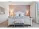 Bedroom featuring a comfortable bed, natural lighting, and light pink accent wall at 4080 Oaktree Dr, Davenport, FL 33837