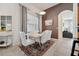 Inviting dining area with white table and chairs, stylish decor, and natural light at 4080 Oaktree Dr, Davenport, FL 33837