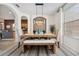 Stylish dining room with a rustic wood table, modern lighting, and decorative accents at 4080 Oaktree Dr, Davenport, FL 33837