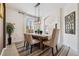 Chic dining area with a wooden table, contemporary lighting, and a comfortable bench at 4080 Oaktree Dr, Davenport, FL 33837