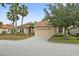 Inviting single-story house featuring a tile roof, two-car garage, and well-maintained front lawn at 4080 Oaktree Dr, Davenport, FL 33837